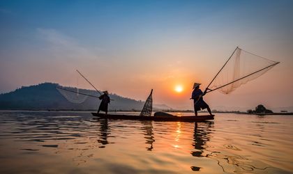 Fischer auf dem abendlichen Mekong