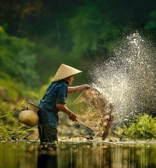 Fischer im Mekong Delta